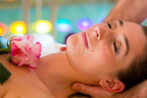 3554091 stock photo woman enjoying head massage in a spa